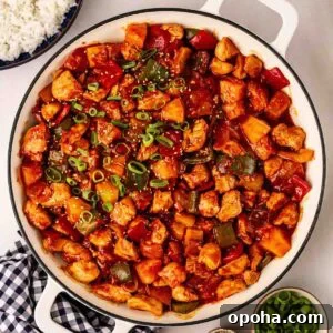 Sweet and Sour Chicken Recipe — Quick Home-Style Version 8 A pan of Sweet and Sour chicken, ready to serve onto plates.