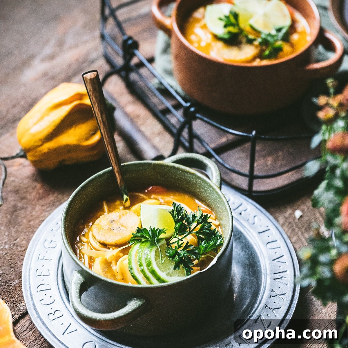 haitian soup joumou featuring plantains garnished with lime slices