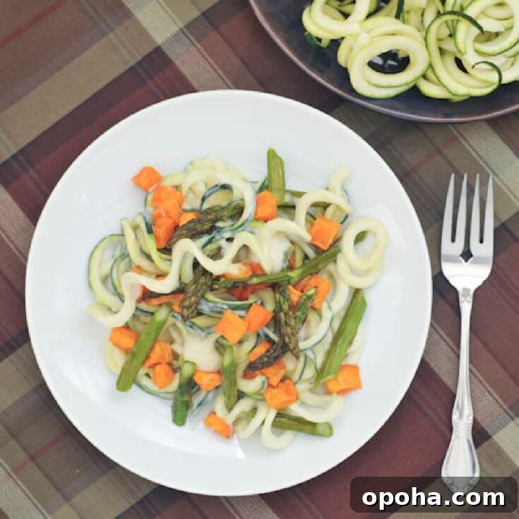 overhead view of roasted sweet potato asparagus pasta using spiralized zucchini as noodles