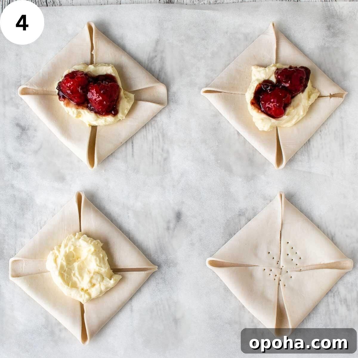 Raspberry Danish Recipe: Flaky Pastry with Fresh Raspberry Filling 7 Folded squares of uncooked pastry with creamy topping and raspberries and jam in the middle of each.