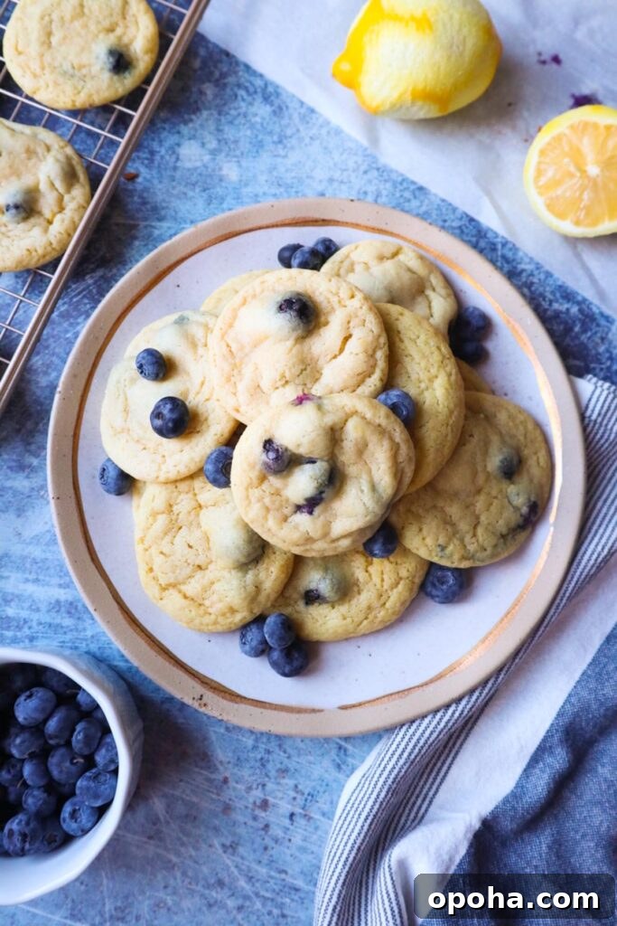 white plate with lemon blueberry cookies with blueberries