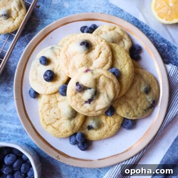 white plate with lemon blueberry cookies with blueberries