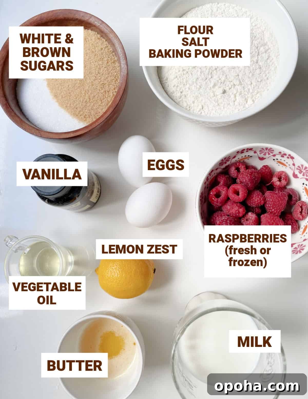 Quick Raspberry Muffins Recipe — Light, Tangy, Perfect for Brunch 4 Bowls on white surface with ingredients for lemon raspberry muffins including sugars, butter, oil, milk, eggs, flour mixture