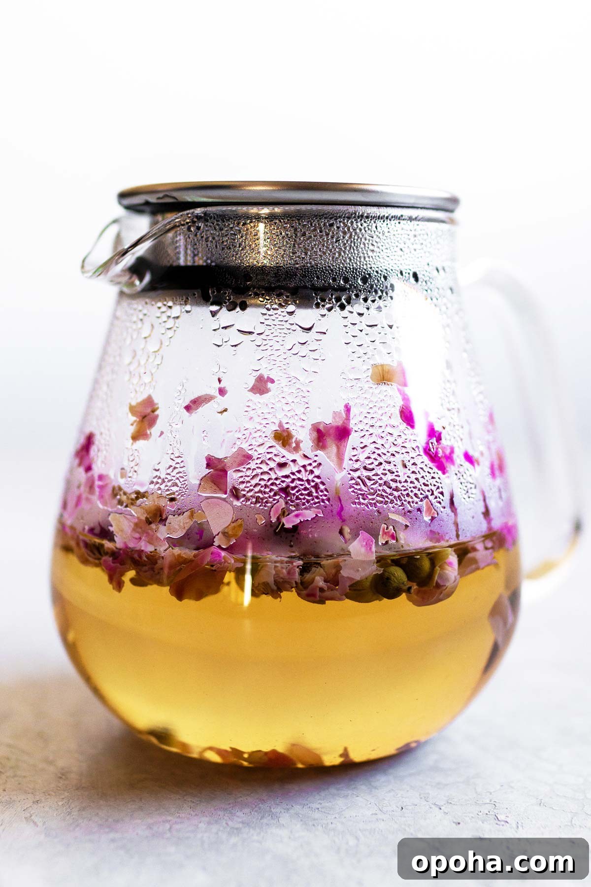 Rose tea in a glass teapot.