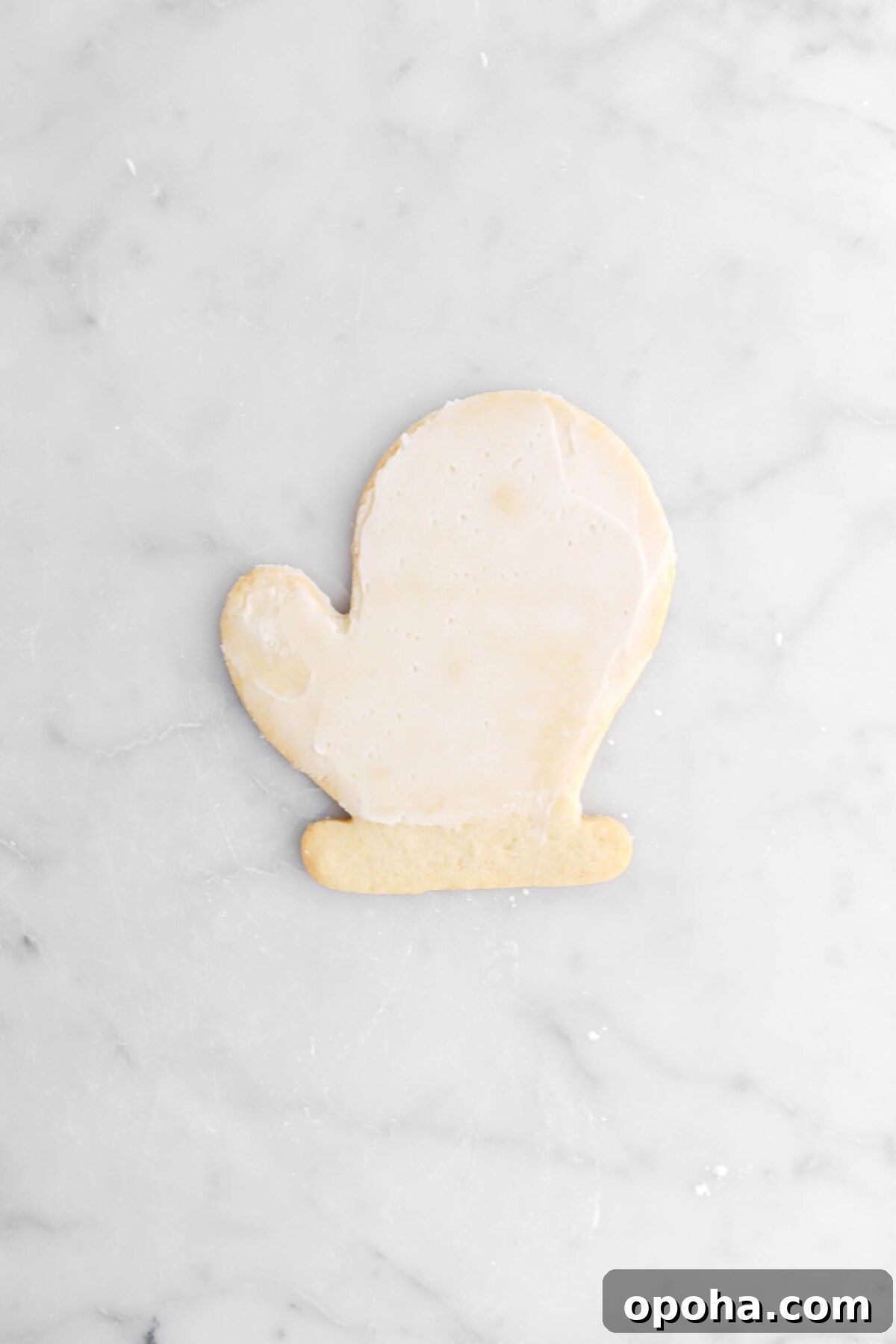 Santa’s Glove Peppermint Sugar Cookies: Festive Holiday Recipe 18 buttercream spread across cookie.