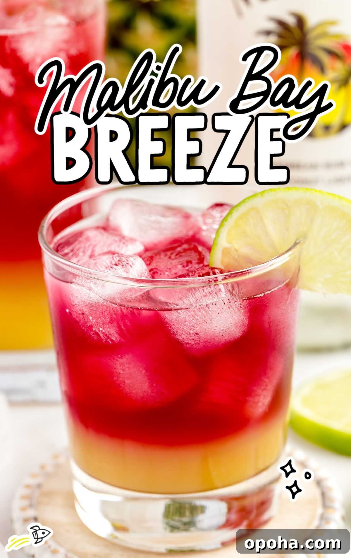 a close-up shot of a Malibu Bay Breeze in a glass garnished with a slice of lime