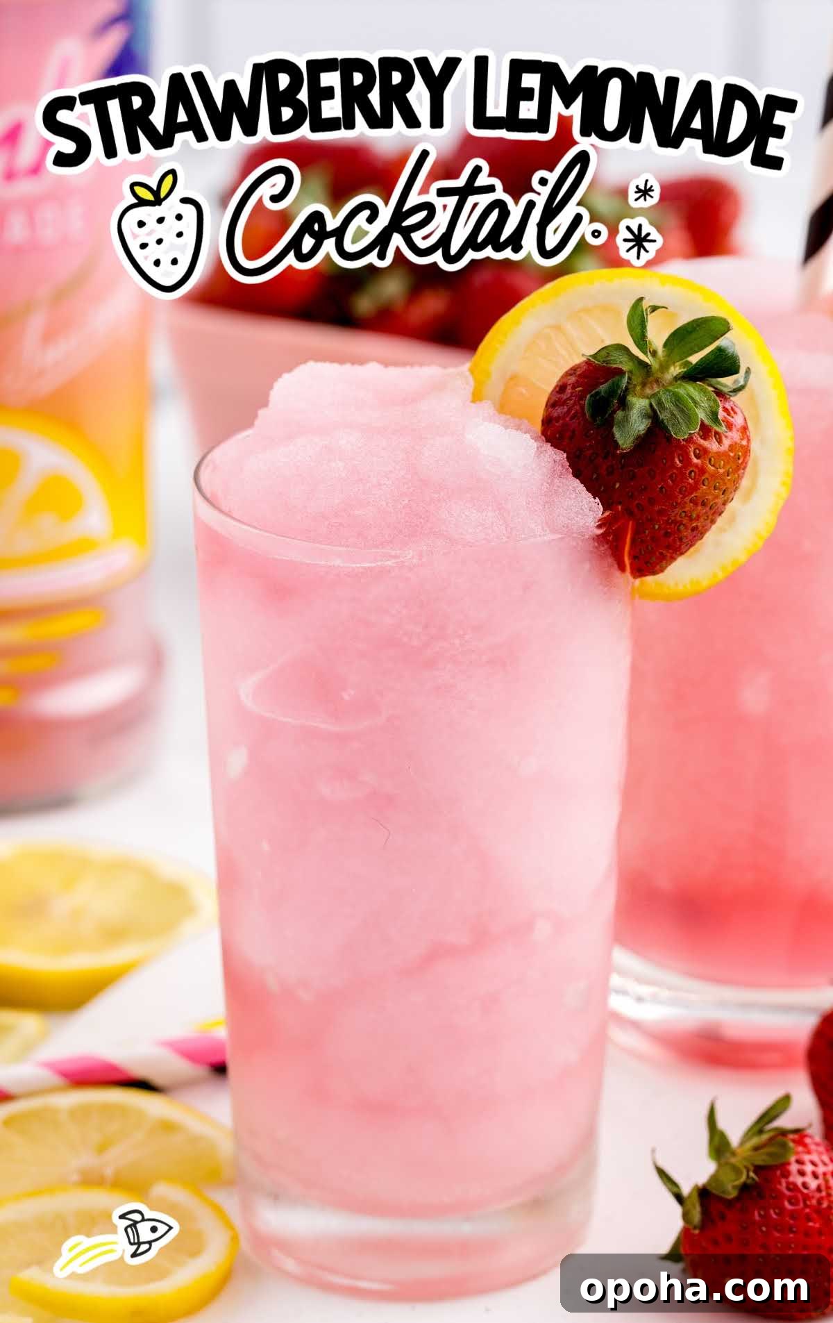 Strawberry Lemonade Cocktail in a glass with a slice of lemon and strawberry in a glass