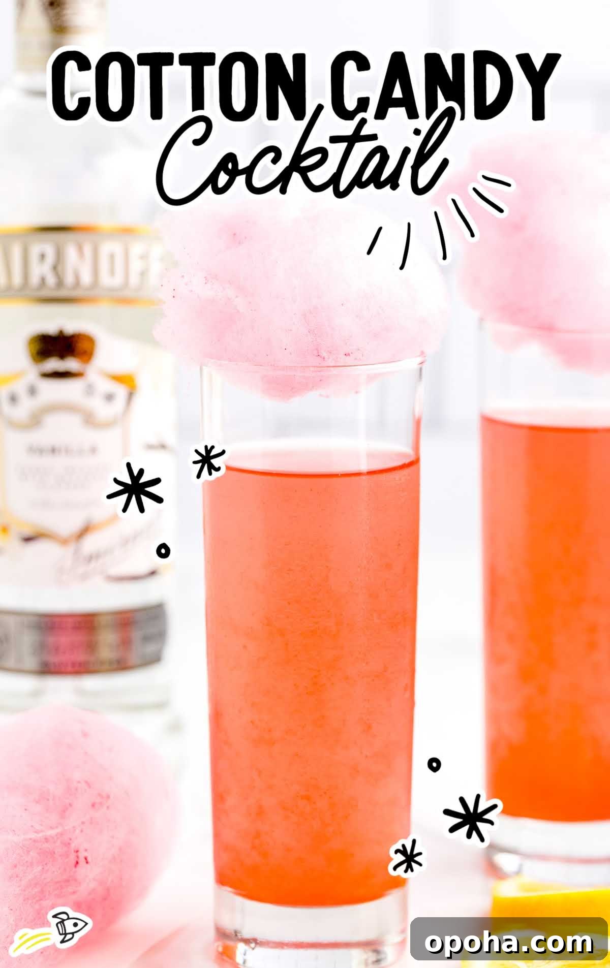 a close up shot of Cotton Candy Cocktails topped with cotton candy
