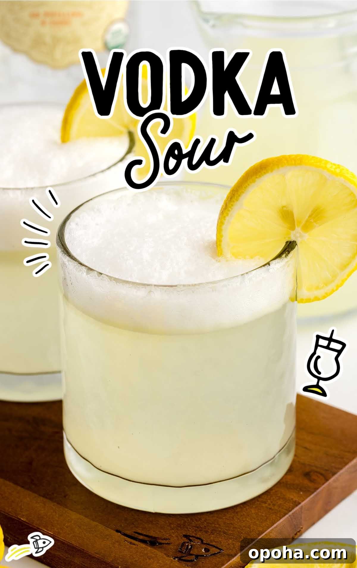 close up shot of a glass of vodka sour garnished with a lemon