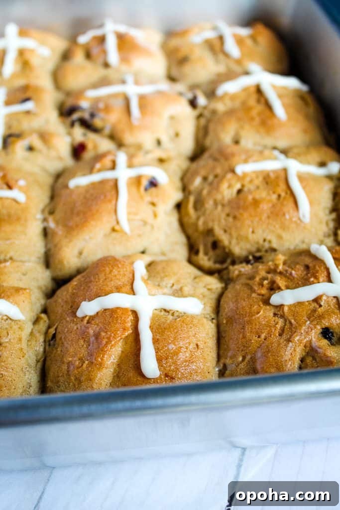 gluten free hot cross buns in a metal pan