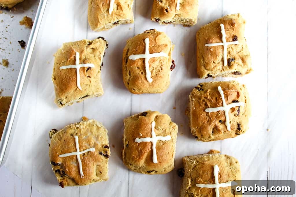 gluten-free hot cross buns on a cookie sheet
