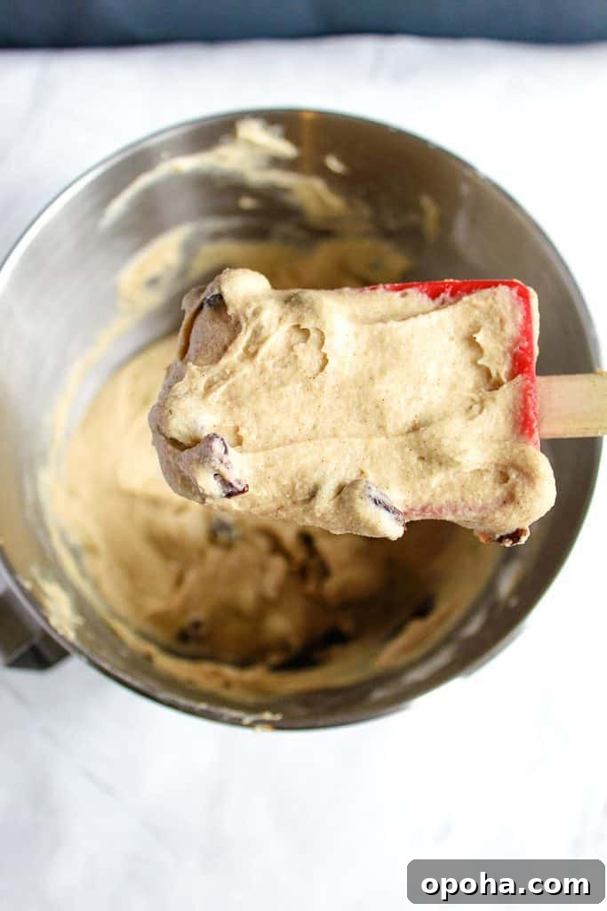 gluten-free hot cross bun batter on a spoon, close up