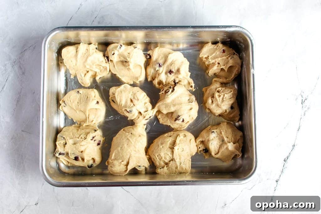 gluten-free hot cross buns portioned out in a baking pan
