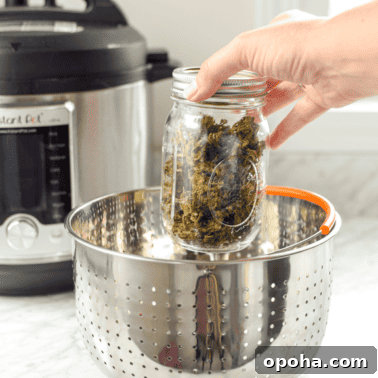 How to Decarb Kief and Make Potent Edibles 13 A picture of a hand placing a jar of cannabis inside an Instant pot for decarboxylation.