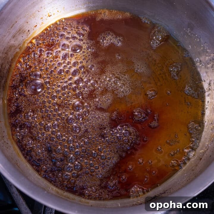 amber-colored boiling sugar in a saucepan