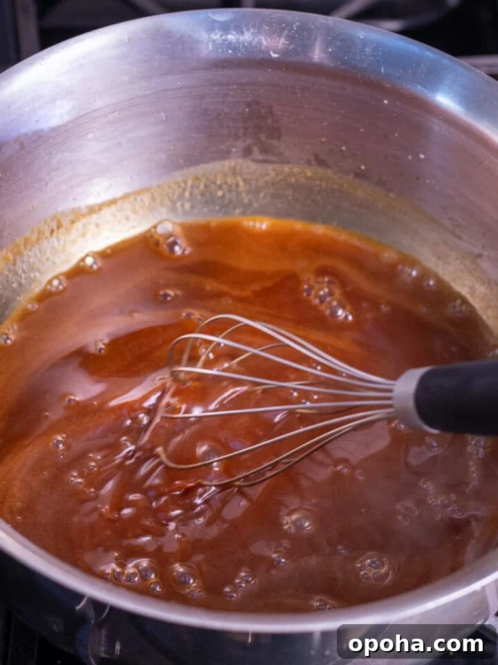whisking the salt and vanilla extract into the salted caramel syrup