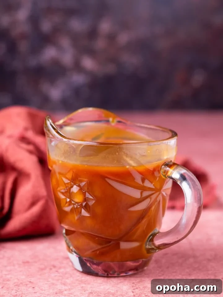 small glass carafe of salted caramel syrup