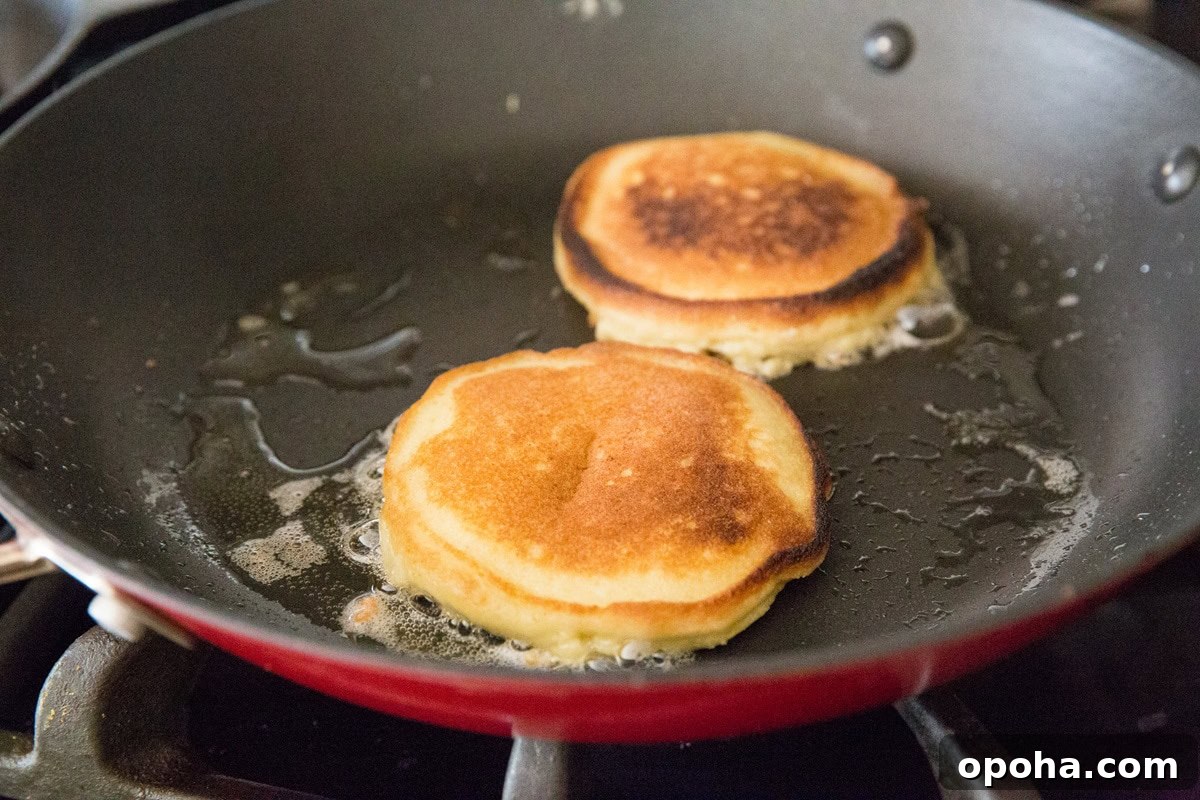Moist Fluffy Keto Pancakes Made with Coconut Flour 9 Cooking coconut flour keto pancakes on the stove top