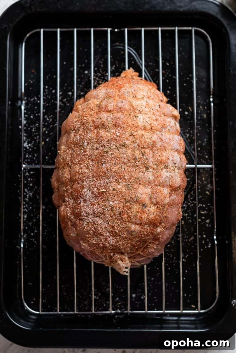 Perfectly Roasted Boneless Turkey Breast Recipe for Juicy Slices 7 boneless turkey breast on a rack lined baking sheet