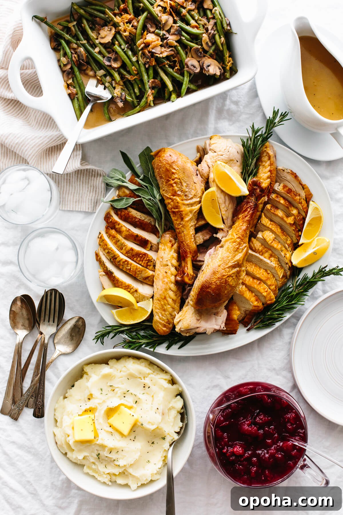Plates of Thanksgiving recipes on a table.