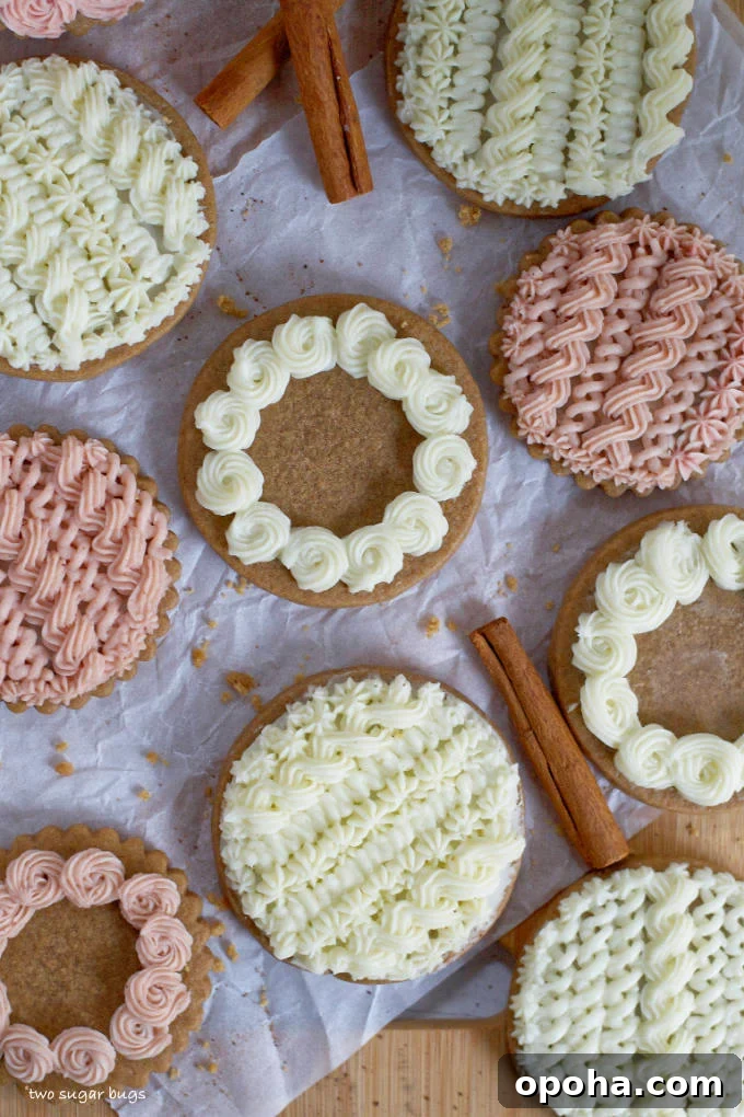 Soft Gingerbread Sugar Cookies Recipe for Tender Holiday Cookies 2 decorated soft gingerbread cookies on parchment paper