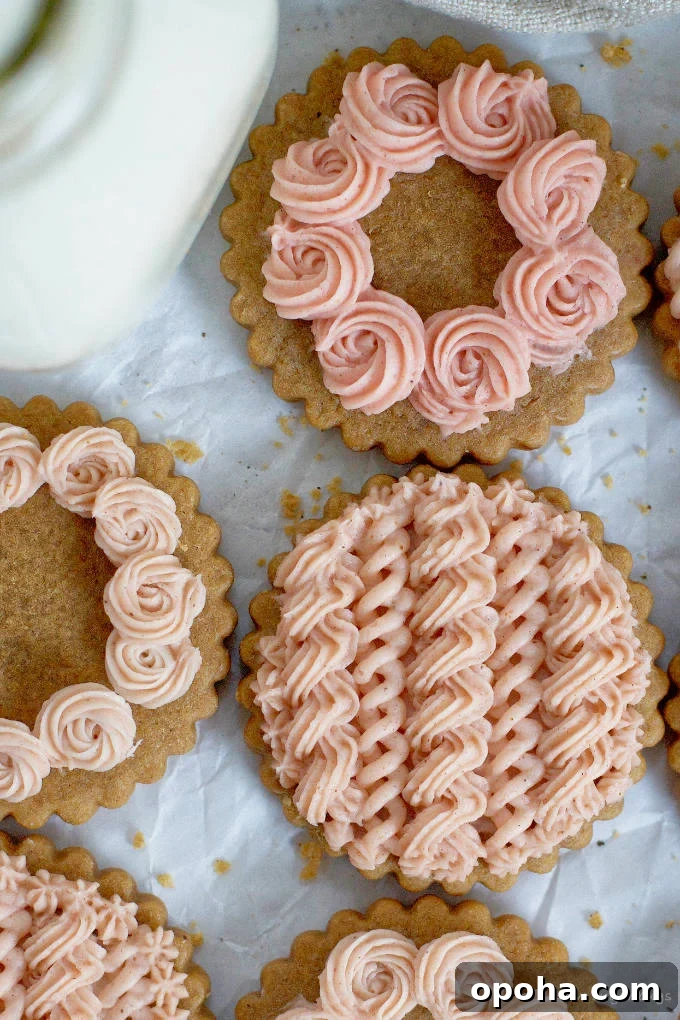 Soft Gingerbread Sugar Cookies Recipe for Tender Holiday Cookies 10 close up of gingerbread cookies with pink frosting