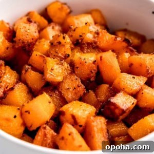 cubed air fryer butternut squash in white bowl