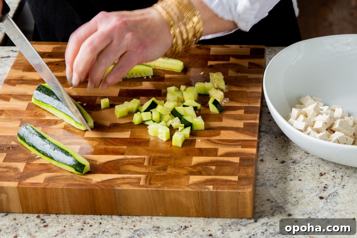 chopping the cucumber