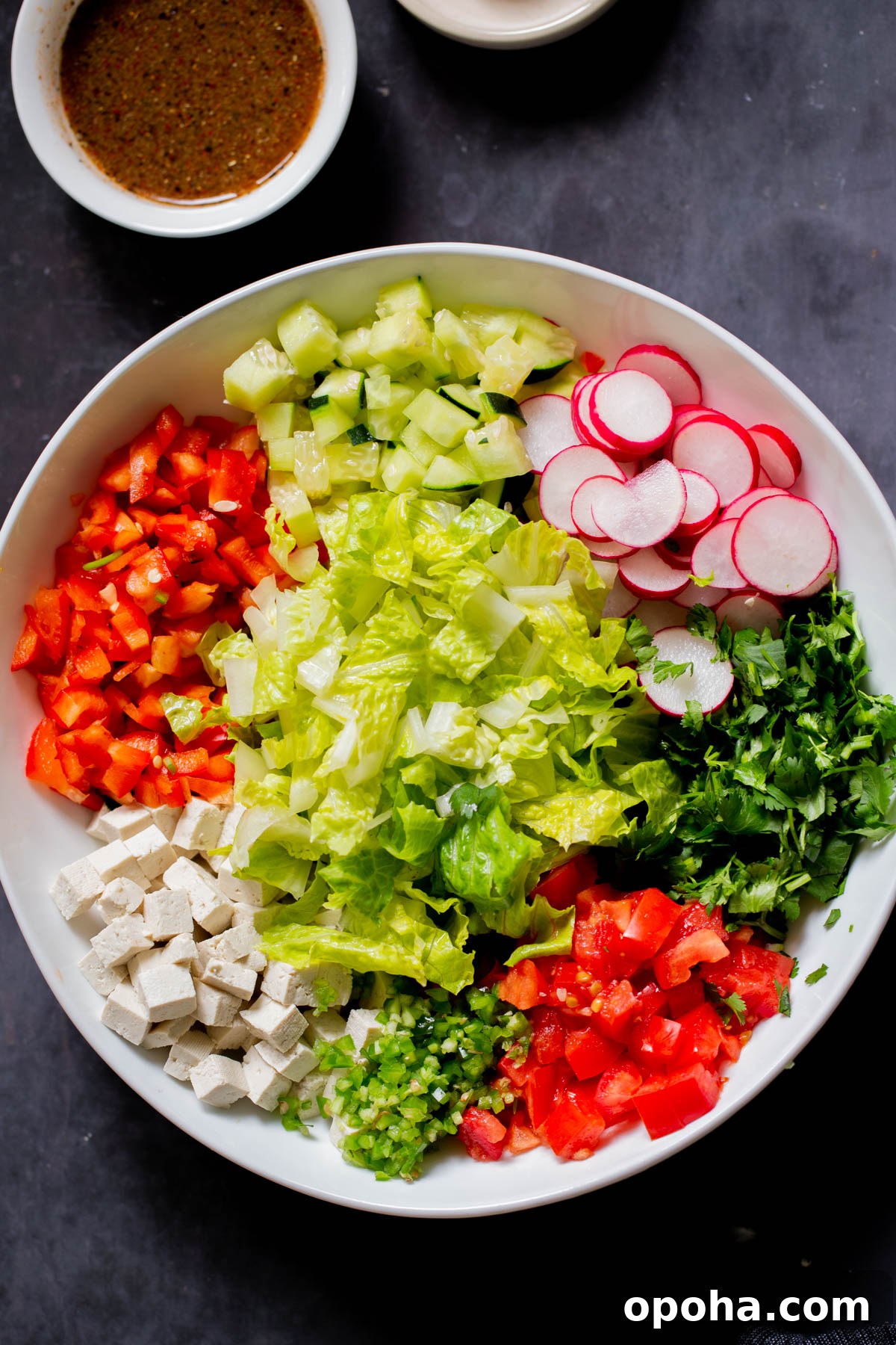 tofu, cilantro, and veggies in the mixing bowl before mixing