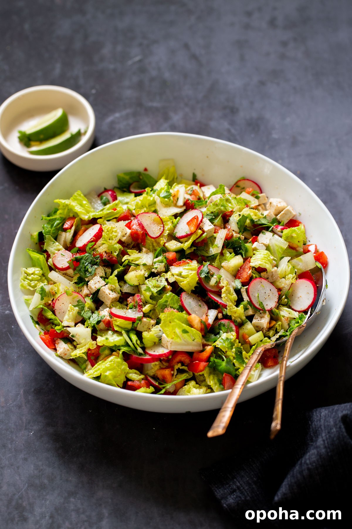 chaat masala salad in the mixing bowl with serving spoons