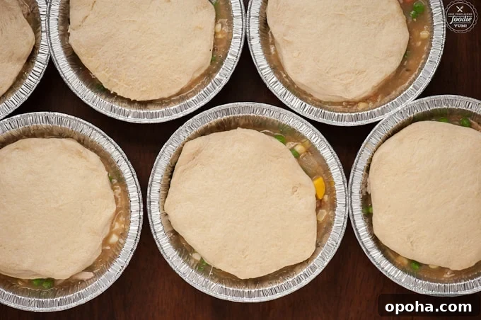 biscuit dough on top of individual chicken pot pie