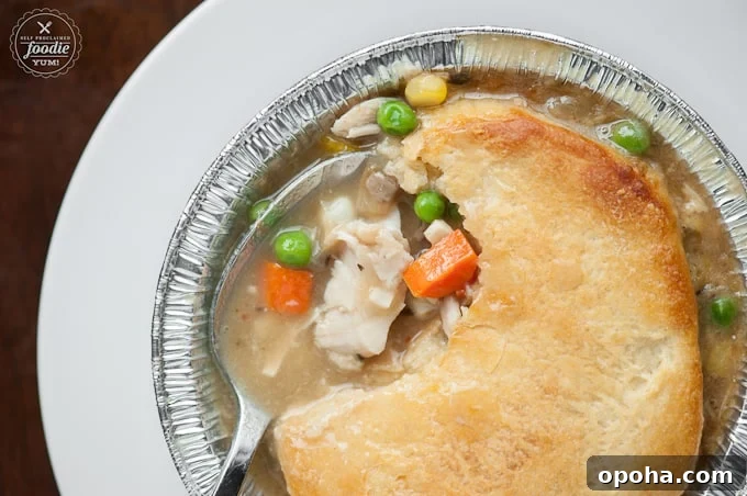 a close up of a bite of chicken pot pie
