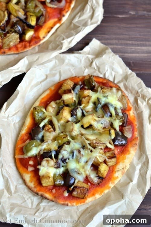 overhead shot of Gourmet Roasted Vegetable Pizza with Vegetable Pizza Toppings served in crinkled parchment paper