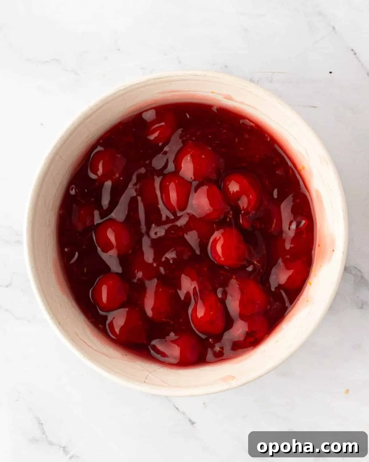 Cherry Pie Bars Recipe: Easy Homemade Cherry Dessert Bars 14 A white bowl with cherry pie filling.