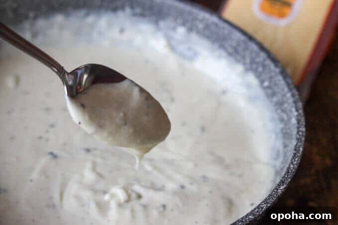 Pan-Seared Ribeye with Cracked Pepper & Mahon Menorca Cheese Sauce