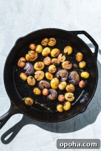 Crispy Air Fryer Baked Potatoes in 30 Minutes 5 baby potatoes in skillet overhead