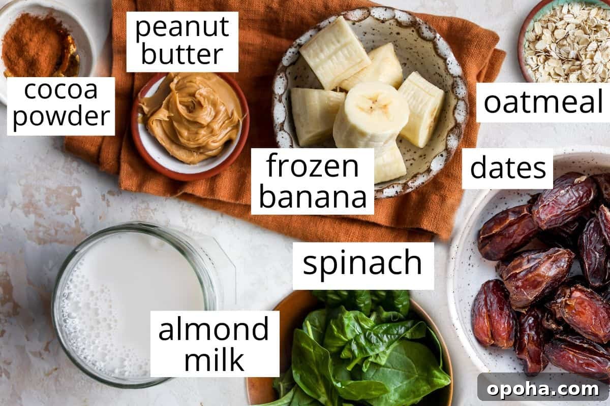 Peanut Butter Banana Oatmeal Smoothie Recipe for Breakfast 2 overhead photo of the labeled ingredients in this Banana Oatmeal Peanut Butter Smoothie
