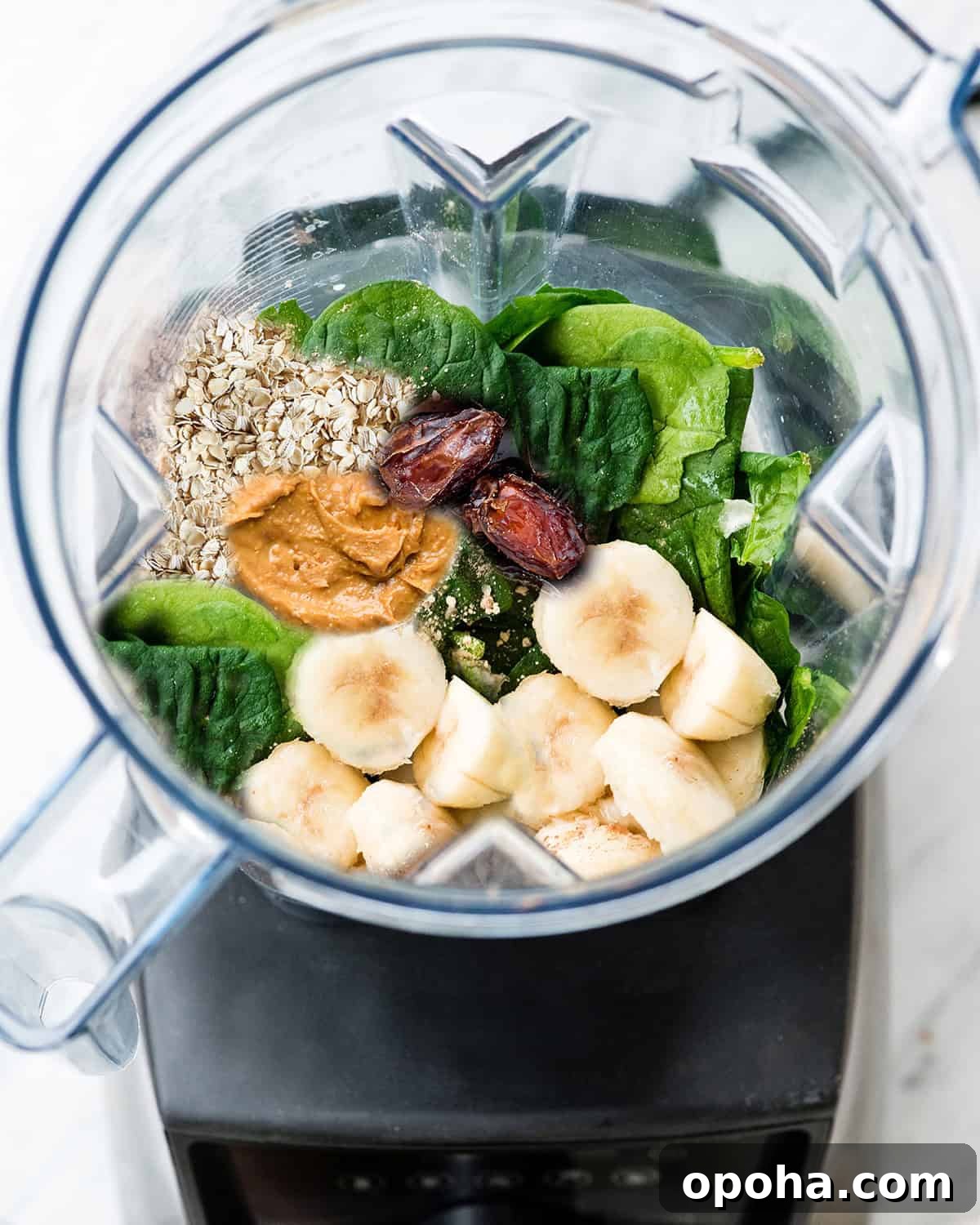 Peanut Butter Banana Oatmeal Smoothie Recipe for Breakfast 3 ingredients for Banana Oatmeal Peanut Butter Smoothie in a blender before blending