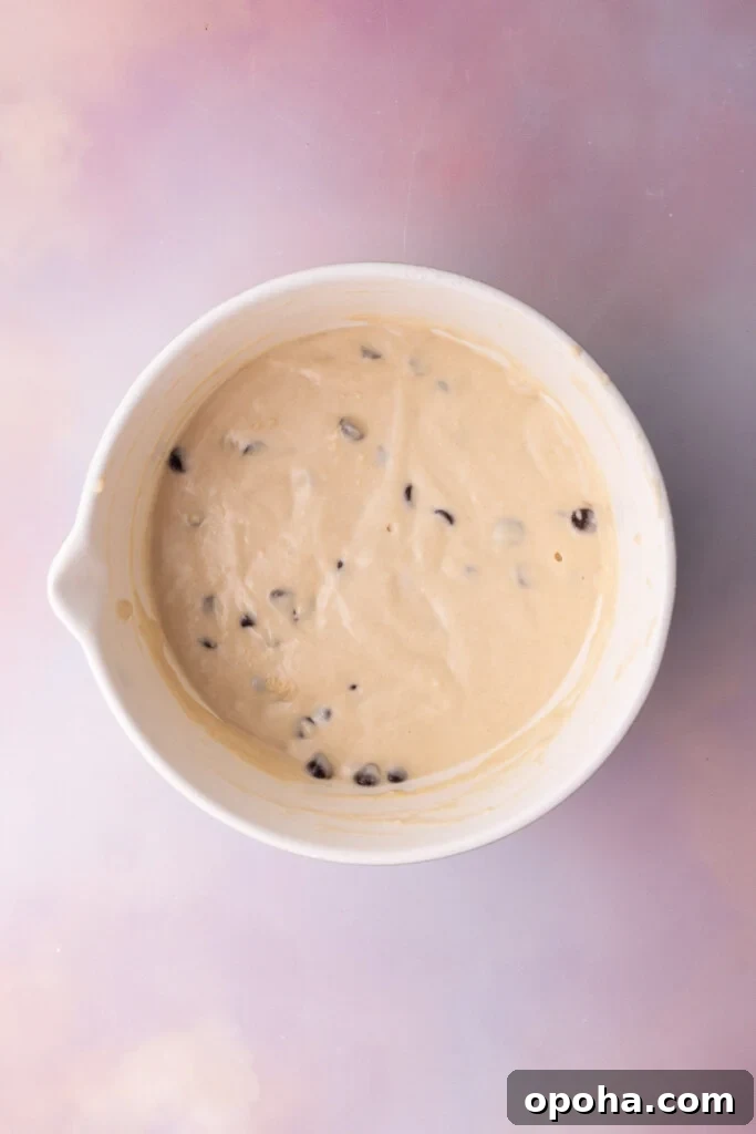 Chocolate chips folded in to waffle batter.