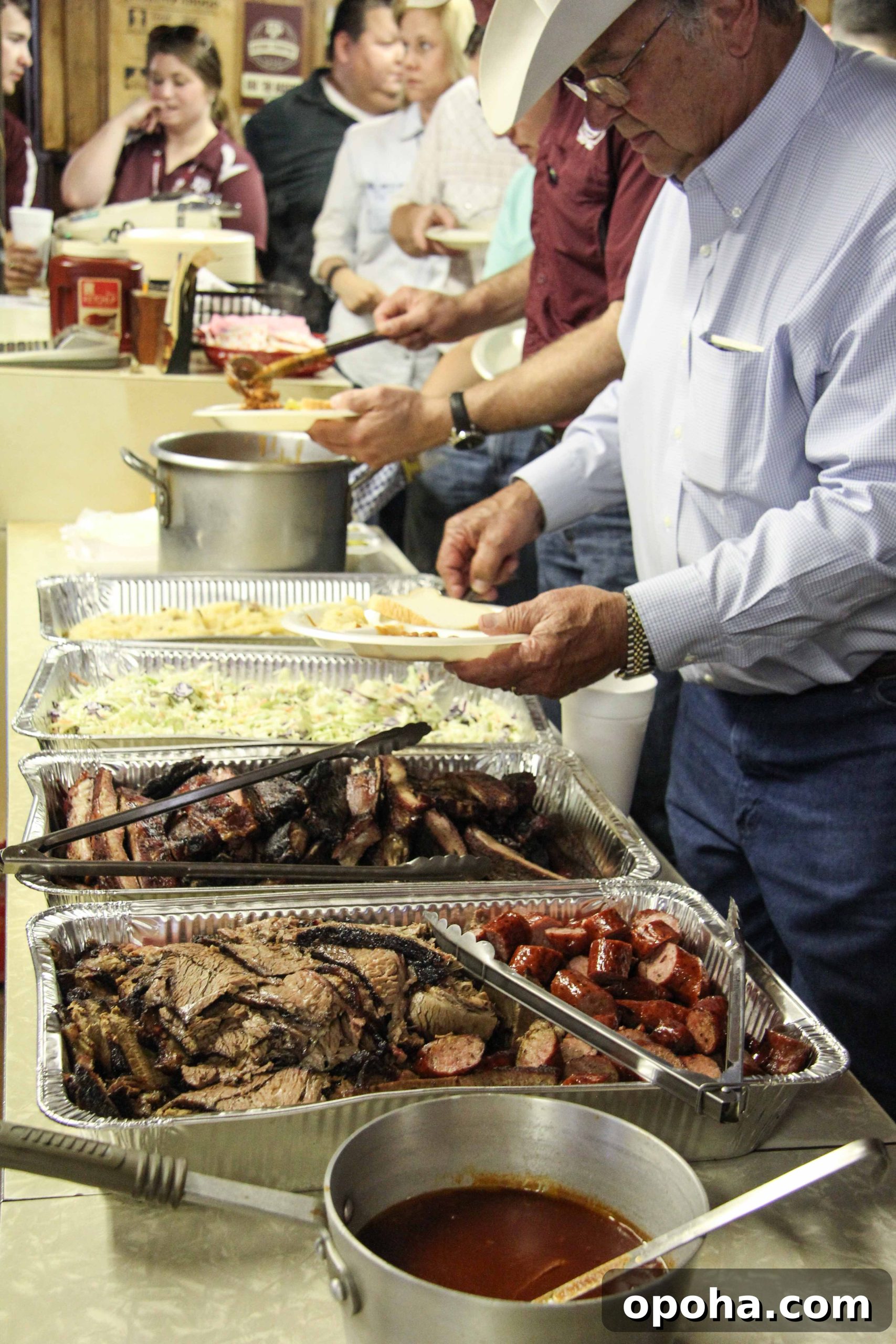 Tom Perini, of Perini Ranch, loads up on lunchtime barbecue