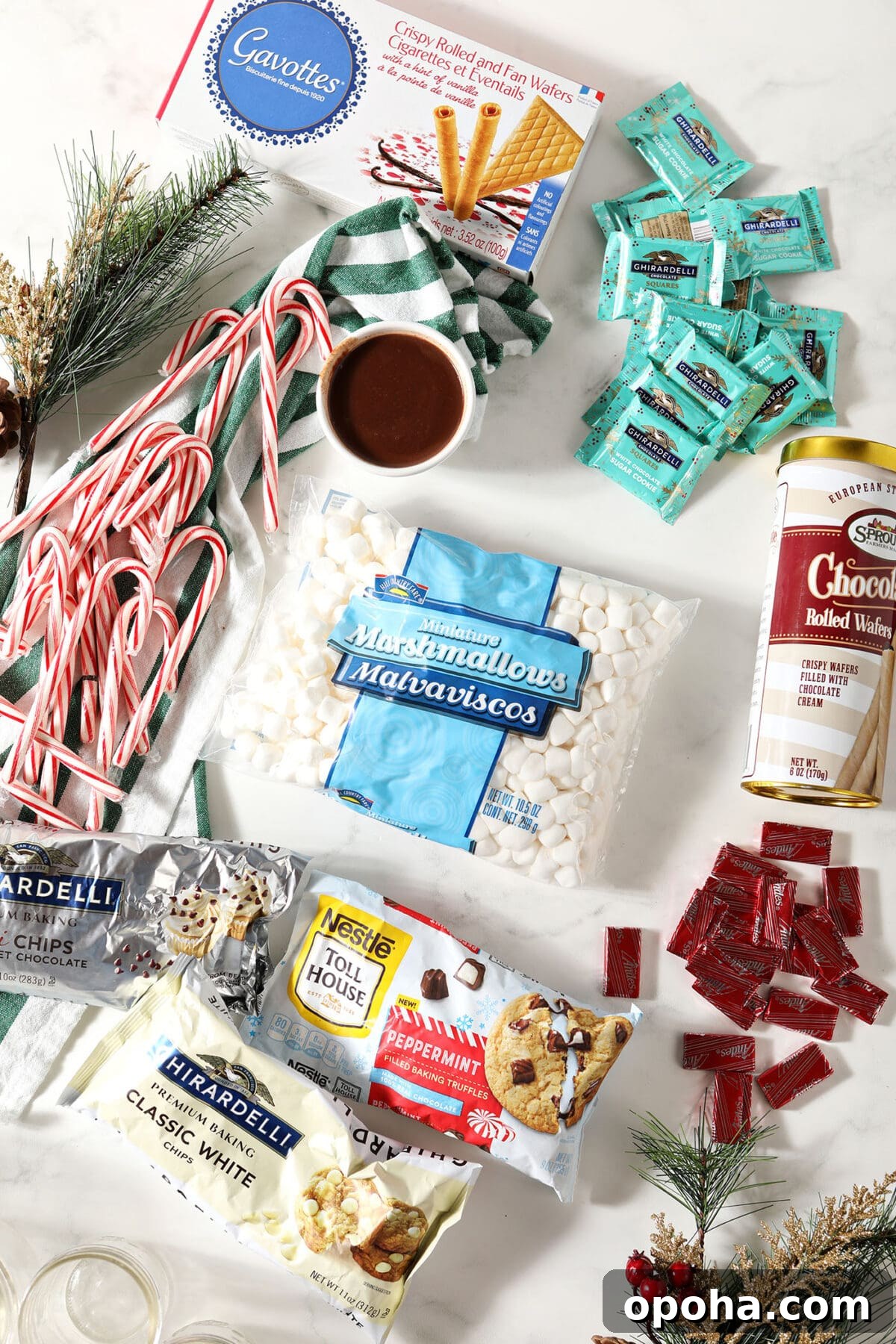 Create a DIY Hot Chocolate Bar for Parties and Gatherings 3 Ingredients to make a hot chocolate bar on a white surface with pine needles