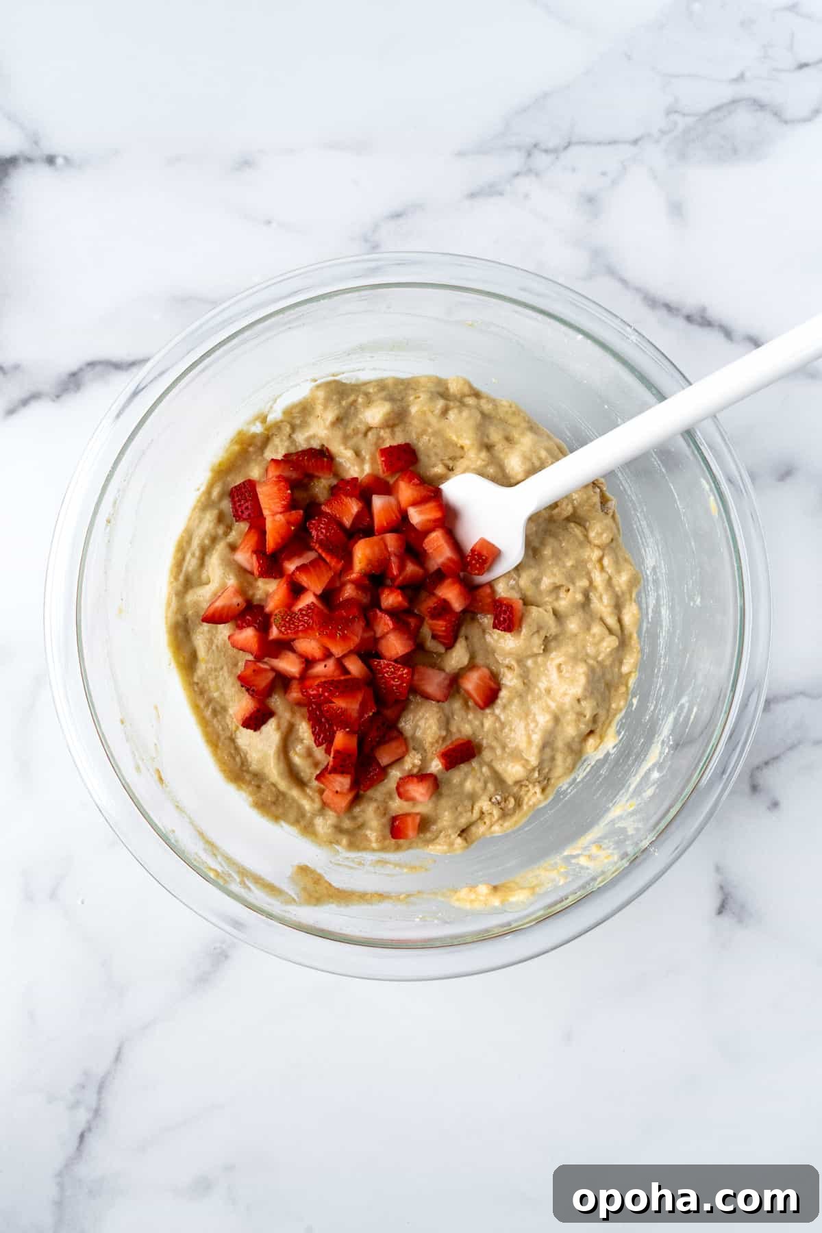 Strawberry Lemon Muffins Batter in a glass mixing bowl.