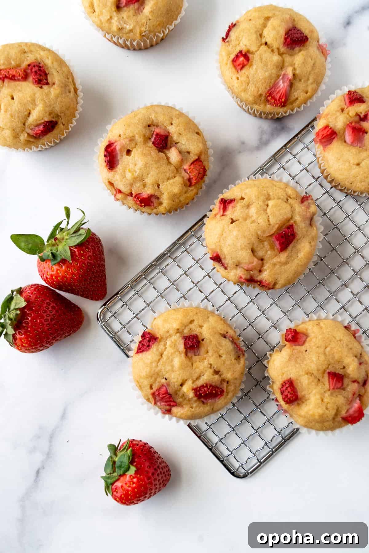 Strawberry Lemon Muffins on a wire rack.