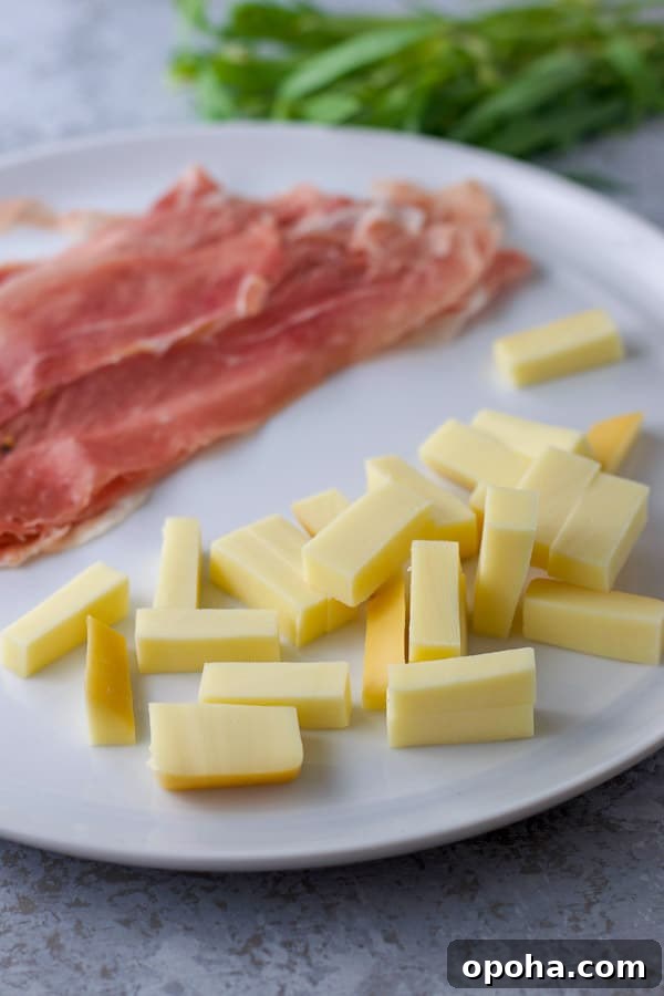 Gouda slices, prosciutto and tarragon in the background