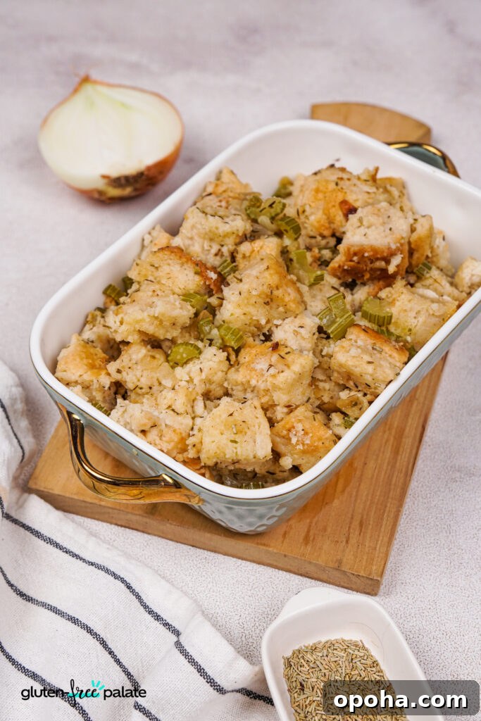 Gluten-Free Holiday Stuffing Recipe for Flavorful Celebrations 5 Gluten-free stuffing in a white serving dish on a wooden cutting board.