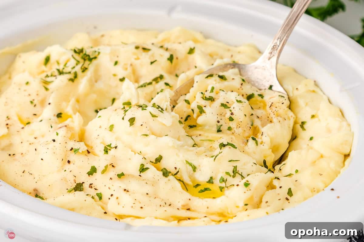 Decadent Million Dollar Mashed Potatoes Recipe 10 white bowl of mashed potatoes