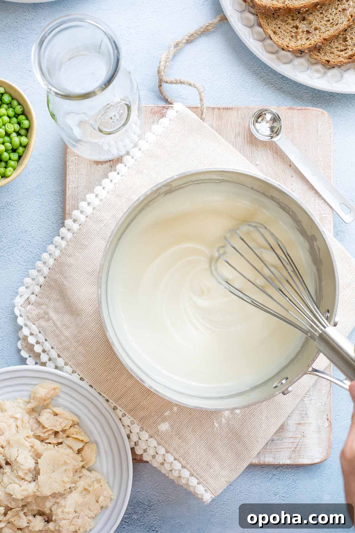 Whisk in pan as cream sauce thickens.