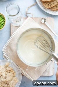 Whisk in pan as cream sauce thickens.