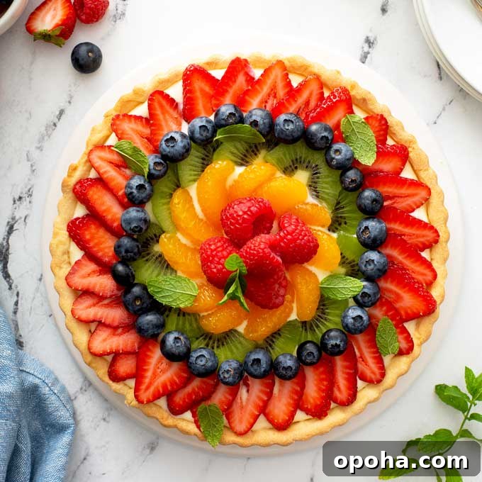 14 Delicious Easter Recipes to Make at Home 13 Top view of a French Tart on a white serving platter.
