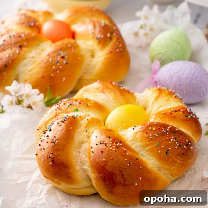 14 Delicious Easter Recipes to Make at Home 5 Golden brown soft bread wreath with a yellow easter egg on the top